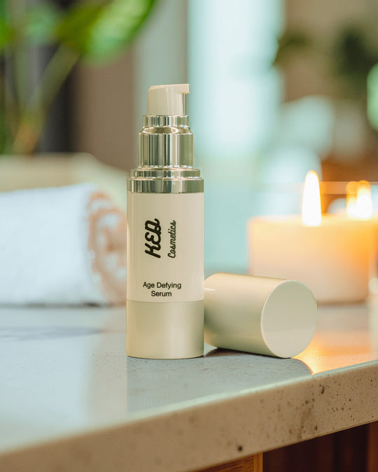Age Defying Serum bottle on a countertop showcasing age defying serum benefits for youthful skin.