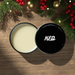 Beard butter benefits in a black tin can, designed for nourishing and moisturizing facial hair.